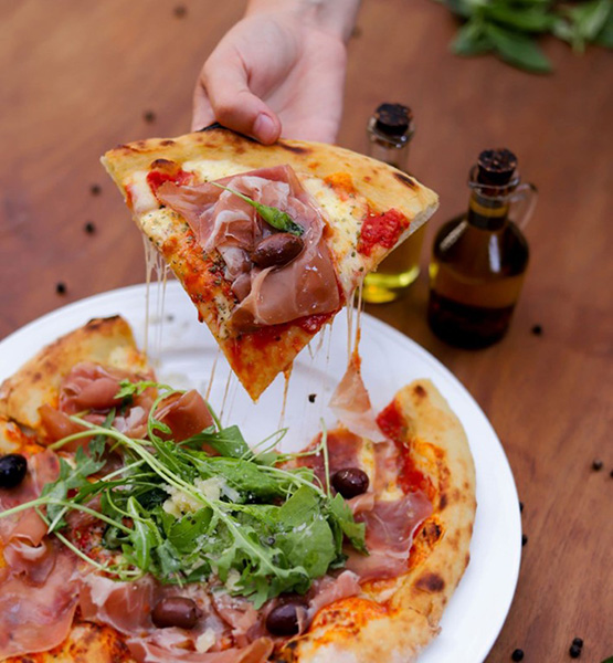 Muzza Sourdough Pizza Prosciutto, Arugula, and Parmesan