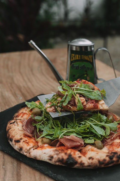 Muzza Sourdough Pizza Prosciutto, Arugula, and Parmesan